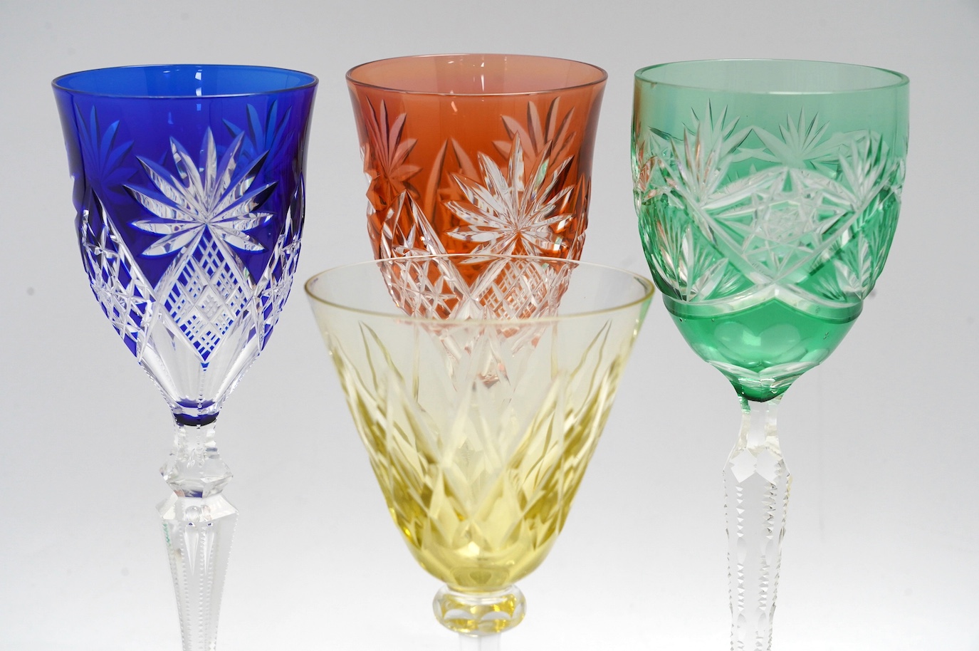 Ten cut glass colour flashed wine glasses, tallest 21.5cm. Condition - good